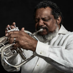 Photo of Gabriel Bey playing a trumpet